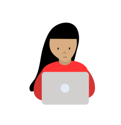 A woman sits at a laptop.