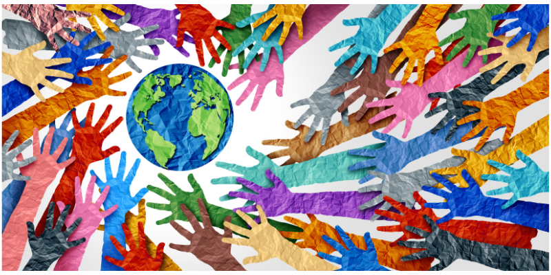 Multi-colour, diverse hands holding together the planet.